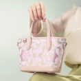 model-seated-carrying-brocade-bag-on-knees