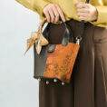 model-wearing-plum-blossom-handbag-crossbody