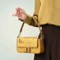 yunjin-brocade-leather-handbag-embroidered-butterfly-pattern-model-sitting-knee-handheld